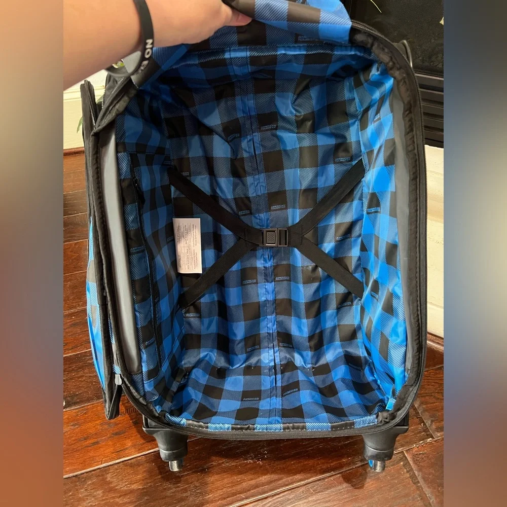 American Tourister Black and Blue Carry-On Spinner Suitcase